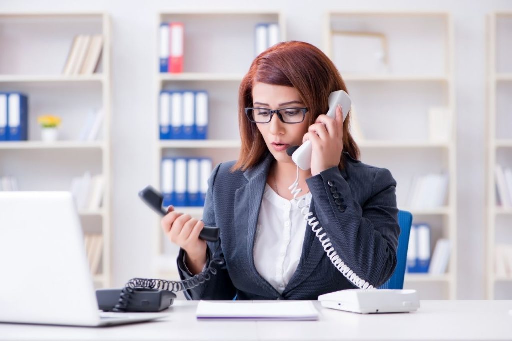 Lady assisting clients through phone calls.