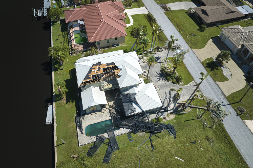 Hurricane Ian destroyed house in Florida residential area. Natural disaster and its consequences