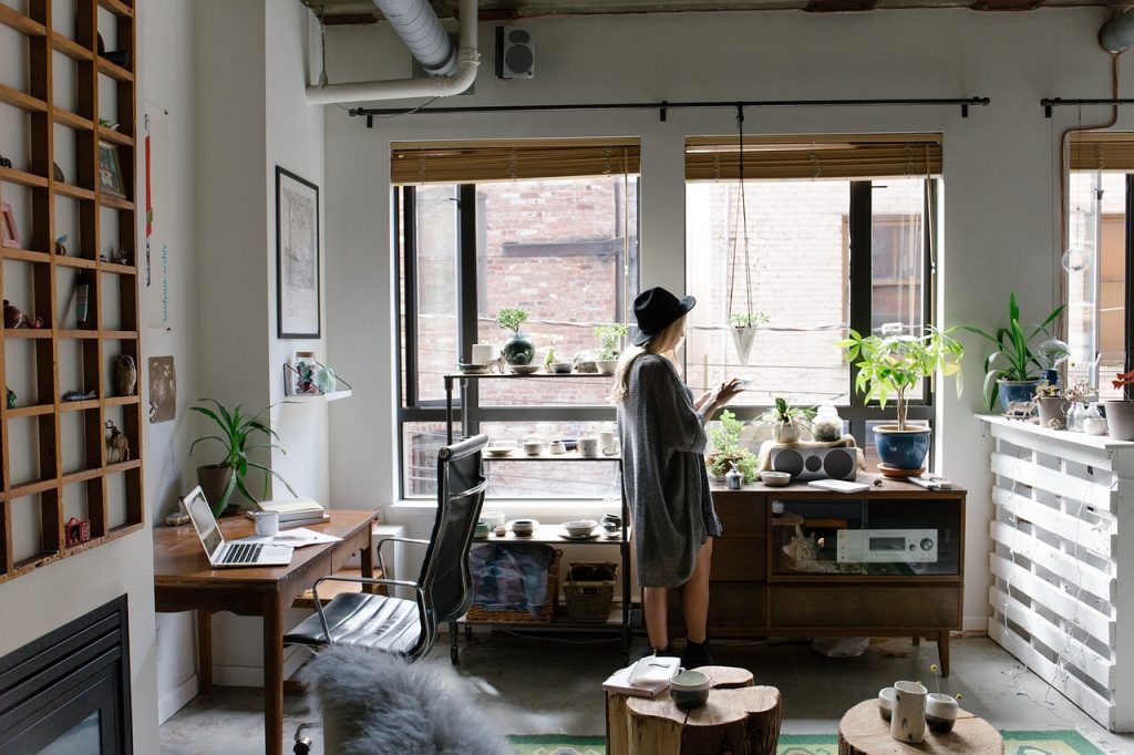 Woman in her home browsing on her tablet